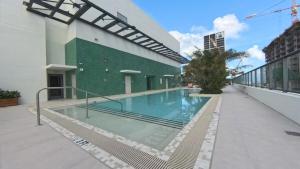 a swimming pool on the side of a building at C5103 Outstanding Studio in the Heart of Downtown in Miami