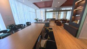 a large lobby with a long table and chairs at C5103 Outstanding Studio in the Heart of Downtown in Miami +33 photos