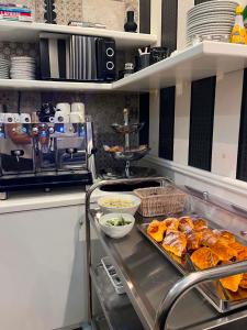 a kitchen with a tray of food on a counter at Bramble Luxury Suites in Rome +30 photos