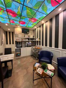 a living room with a stained glass ceiling at Bramble Luxury Suites in Rome