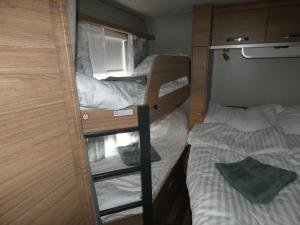 a pair of bunk beds in a small room at Szentkút Kemping Vasvár in Vasvár