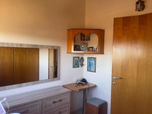 a bathroom with a sink and a mirror at VILLA ANTONIS in Kos