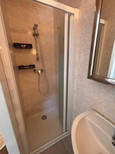 a bathroom with a shower and a toilet and a sink at Le Pavillon du Cap d'Antibes in Antibes +54 photos