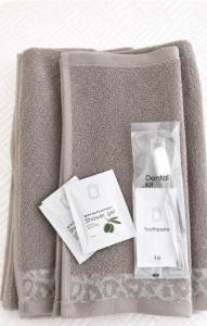 a box with a bottle of soap and a bag of products at Liam House - Stanza 1 in Limbiate