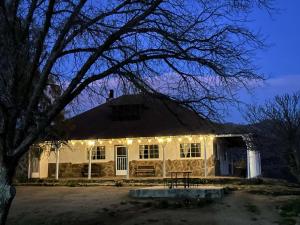 a house with lights on the front of it at Casa Lizany in Camalú +2 photos