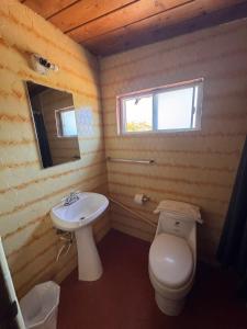 a bathroom with a toilet and a sink at Casa Andres in Camalú
