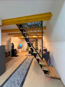 a stairwell in a living room with a glass wall at ZELENI BOR koliba vikendica Pale in Pale