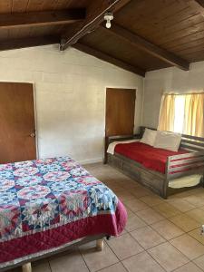 a bedroom with two beds in a room at Rancho Meling Casa Felipe in Camalú +5 photos