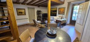a living room with a table and chairs at Casa Coba in Camijanes