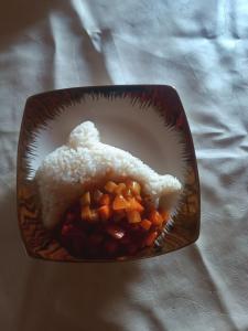 a bowl of food with a piece of bread at Sonkol-resort in Song-Kul +1 photo
