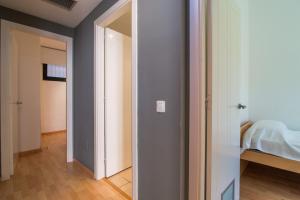 A bed or beds in a room at Costabravaforrent Pedró