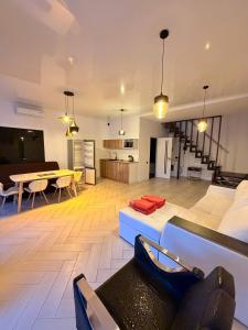 a large living room with a couch and a table at White Villas Koblevo in Koblevo