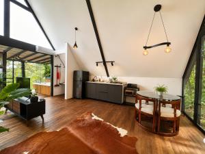 an open living room with a table and a kitchen at Private Luxury A-Frame with Jacuzzi & Mountain View in San Francisco