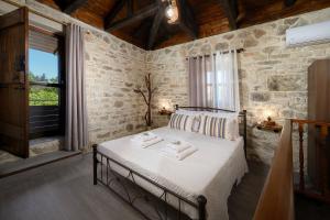 a bedroom with a bed with towels on it at Villa Diamant 1860 in Monókhoron +89 photos