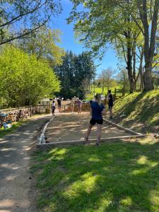 a woman is playing a game in a park at TIthome in Cunlhat