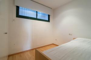 A bed or beds in a room at Costabravaforrent Pedró