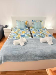 a bedroom with a bed with towels on it at Castle Harbour 209 in Los Cristianos