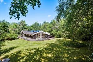a large house in the middle of a green yard at JB274-Fjerritslev-Ronnevej-10 in Kollerup