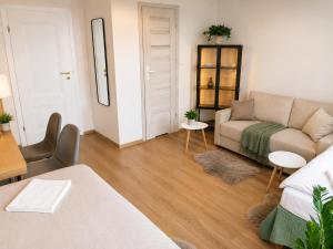 a living room with a couch and a table at Gdańsk in Gdańsk
