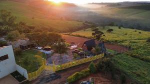 an aerial view of a house in a field at Chalés JH Serra da Canastra in São Roque de Minas