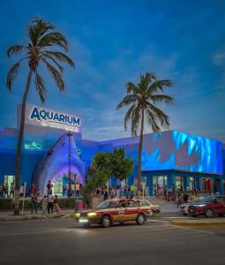 a city street with cars in front of a building at Suites Puerto 201 in Veracruz
