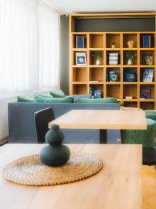 a living room with two tables and a couch at Vyhliadka Galfy in Starý Smokovec