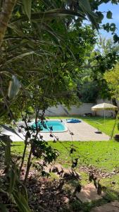 a view of a swimming pool in a yard at A Casa da lua in Lagoa Santa