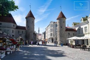 a street in a city with two towers at Boutique Flat - Spa Shower - Sound System in Tallinn