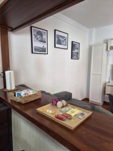 a living room with a counter with a table at Apartamento click center in Ronda +7 photos