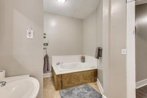 a bathroom with a tub and a toilet and a sink at Mtn Views & Idyllic Setting! Clifton Forge Retreat in Clifton Forge +32 photos