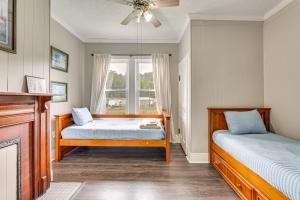 a bedroom with two beds and a window at Mtn Views & Idyllic Setting! Clifton Forge Retreat in Clifton Forge