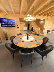 a large dining room with a table and chairs at Chatička in Veľká Lomnica +35 photos