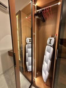 two pieces of luggage in a glass case at Bloom Home in Al Khobar