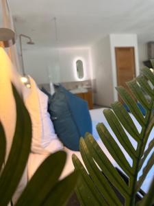 a person sitting on a couch with an umbrella at Suite Canne Or in Bommes