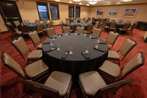 a conference room with a round table and chairs at The Frobisher Inn in Iqaluit