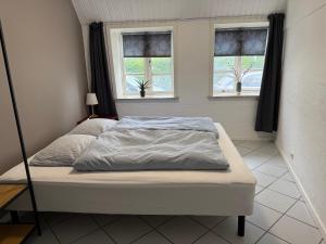 Gulta vai gultas numurā naktsmītnē Apartment with Wifi, close to city center, Beach and forrest
