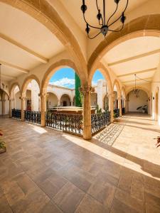 a large building with a large hallway with arches at Palacio de las Rosas in Durango
