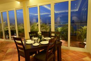 a dining room with a table and chairs and a window at Silver Pride Boutique Hotel in Jaipur