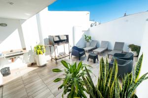 a room with chairs and plants in a building at Augusta in Salta