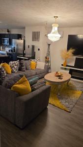 a living room with a couch and a table at North in Camby