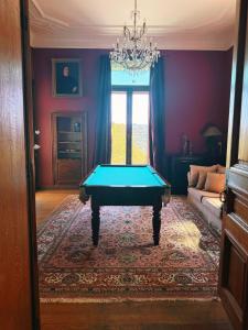 a living room with a pool table in it at Manoir Borzeux in Stavelot
