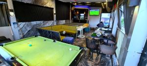 an overhead view of a pool table in a bar at Kiarra Suites Owerri in Owerri