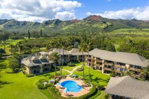 an aerial view of a resort with a swimming pool at Makai Dream (Oceanfront) in Lihue