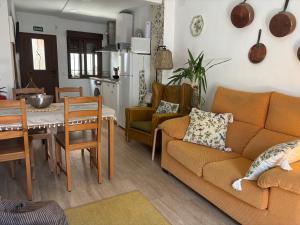 a living room with a couch and a table at Casa Árbol in Pedro Bernardo