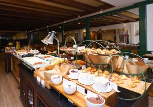 a buffet line with many different types of food at Radisson Oscar Freire in São Paulo