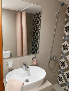 a bathroom with a sink and a shower at Avli in Samothraki +36 photos
