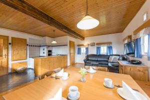 a living room with a table and a couch at Biobauernhof Gegg in Schwanberg