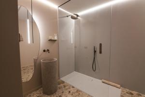 a shower with a glass door in a bathroom at Wijndomein Leine in Opwijk