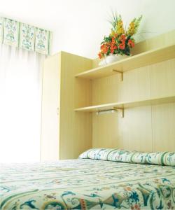 Postel nebo postele na pokoji v ubytování Hotel Fabris