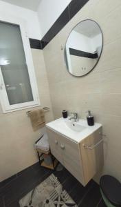 a bathroom with a sink and a mirror at AG Scalo d amore house in Naples